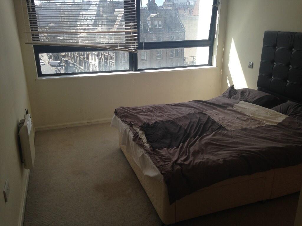 A cozy double bedroom featuring a comfortable b...