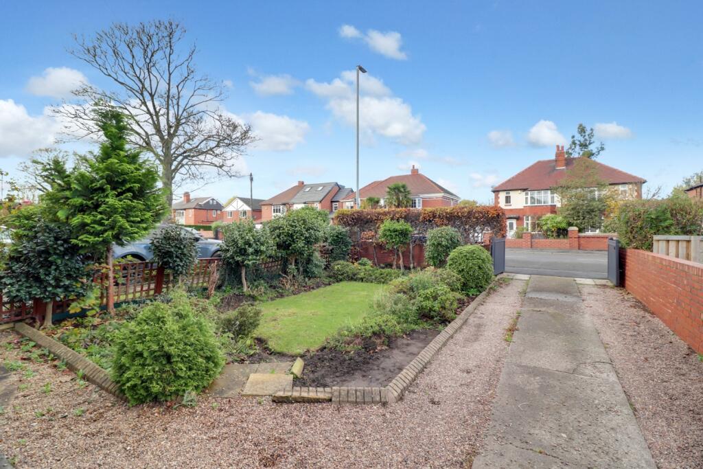 Front garden and private driveway
