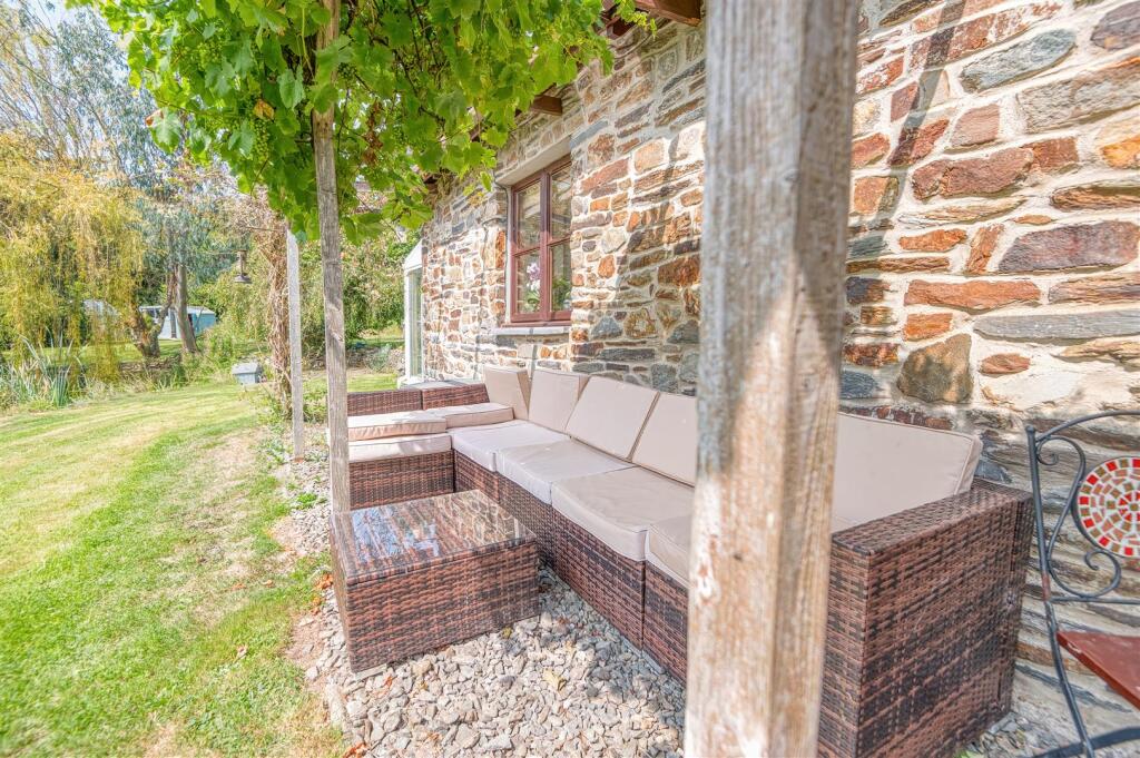 Outside seating under the grape vine