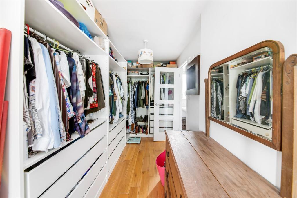 WALK-IN WARDROBE TO BEDROOM ONE