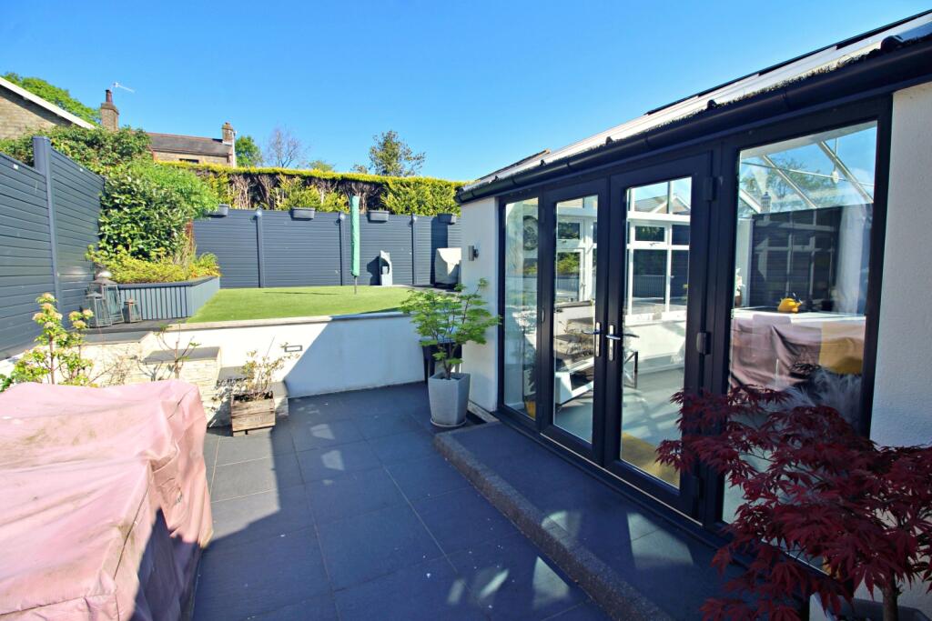 Side Tiled Patio to Garden