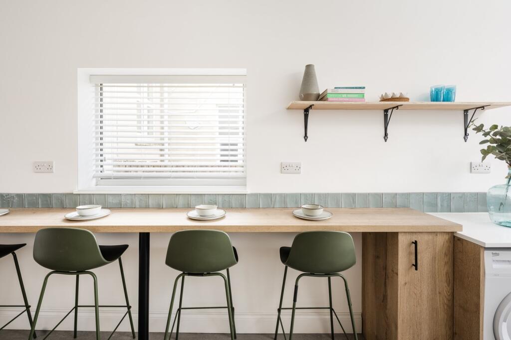 A modern kitchen with a clean design, featuring...