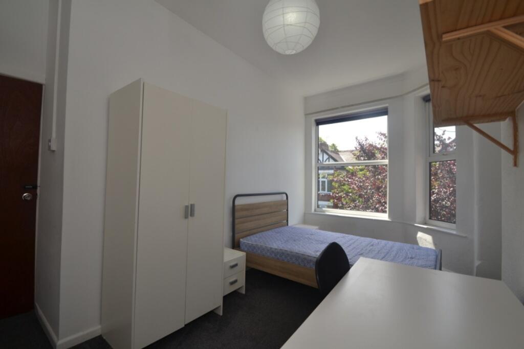Bright and inviting double bedroom featuring am...