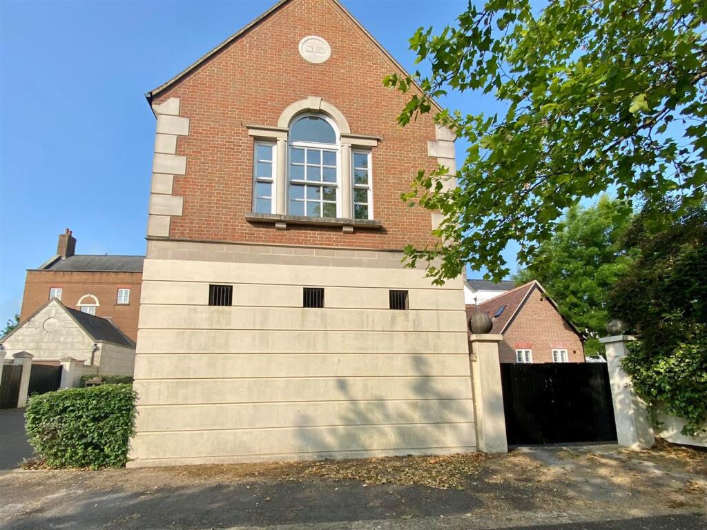 Double gates to covered carport