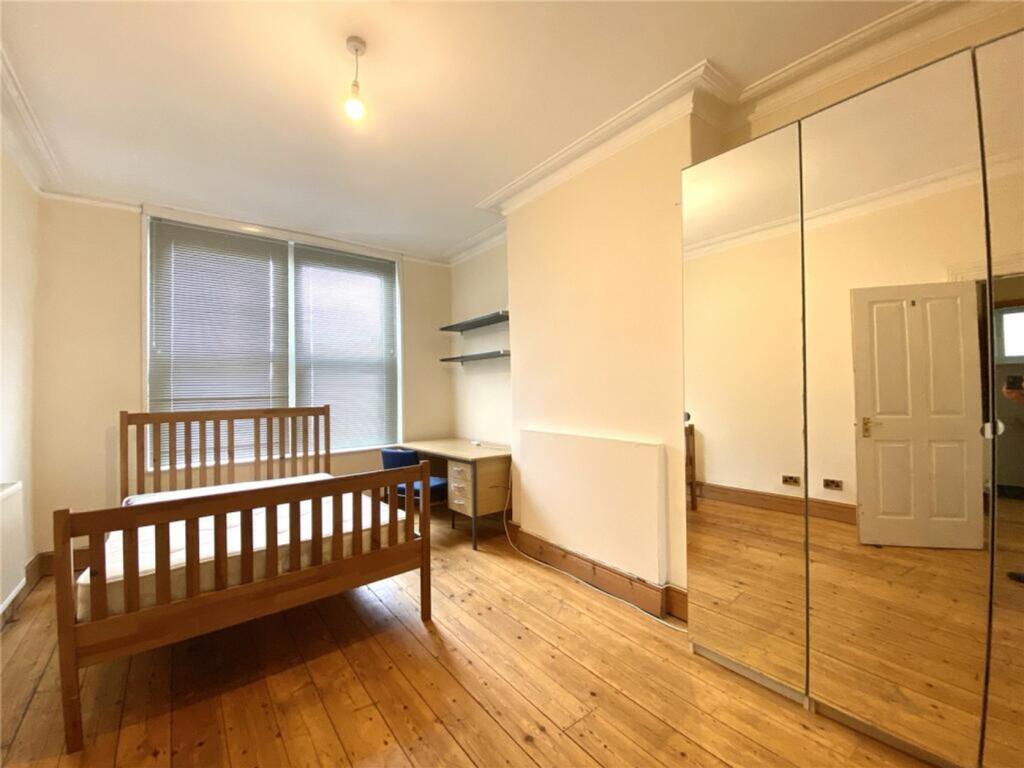 A bright and spacious double bedroom featuring ...