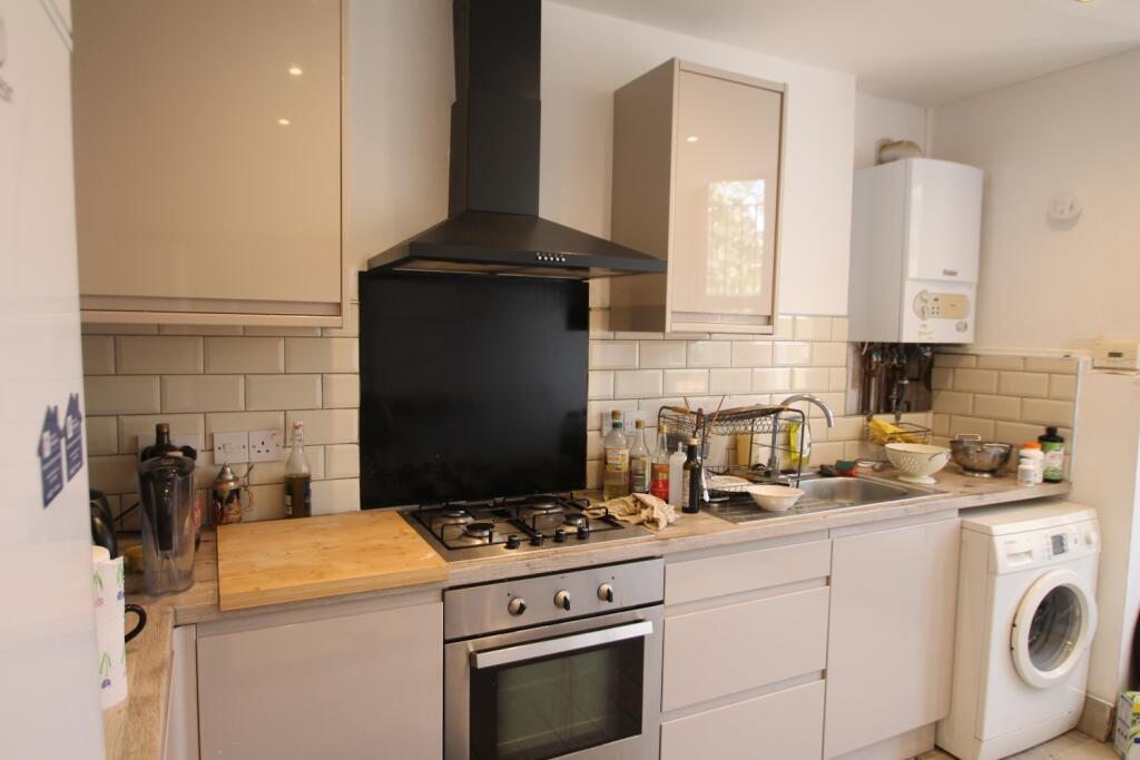 A modern kitchen featuring a gas hob with oven,...