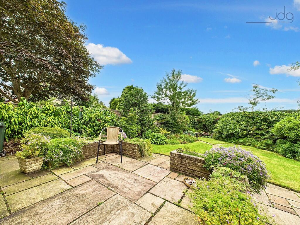 Garden with patio seating area
