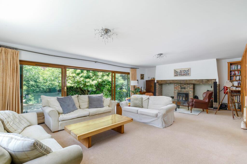 Living room with fireplace and doors to patio