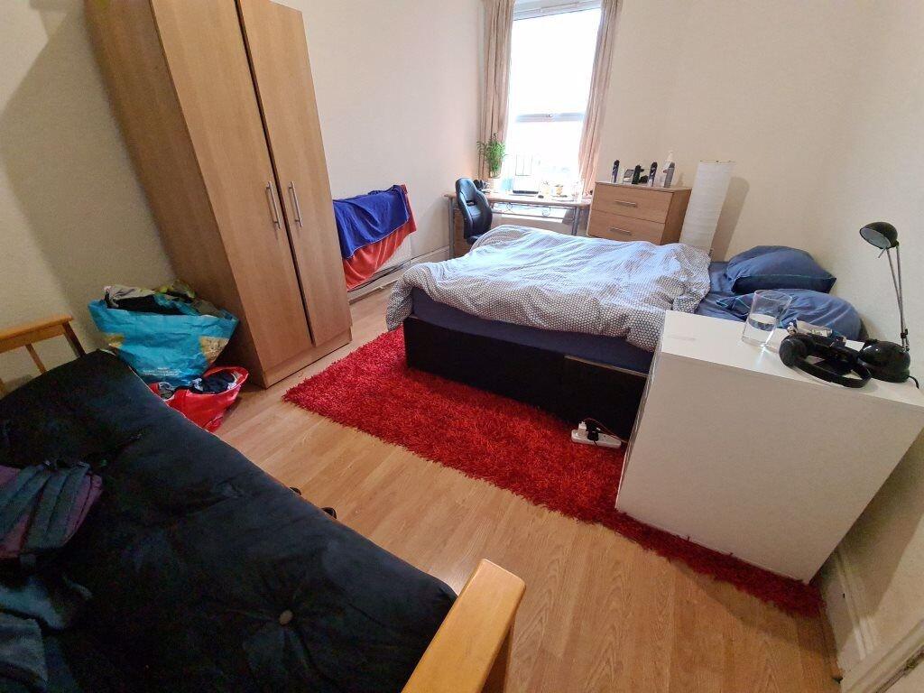 A cozy double bedroom featuring a comfortable d...