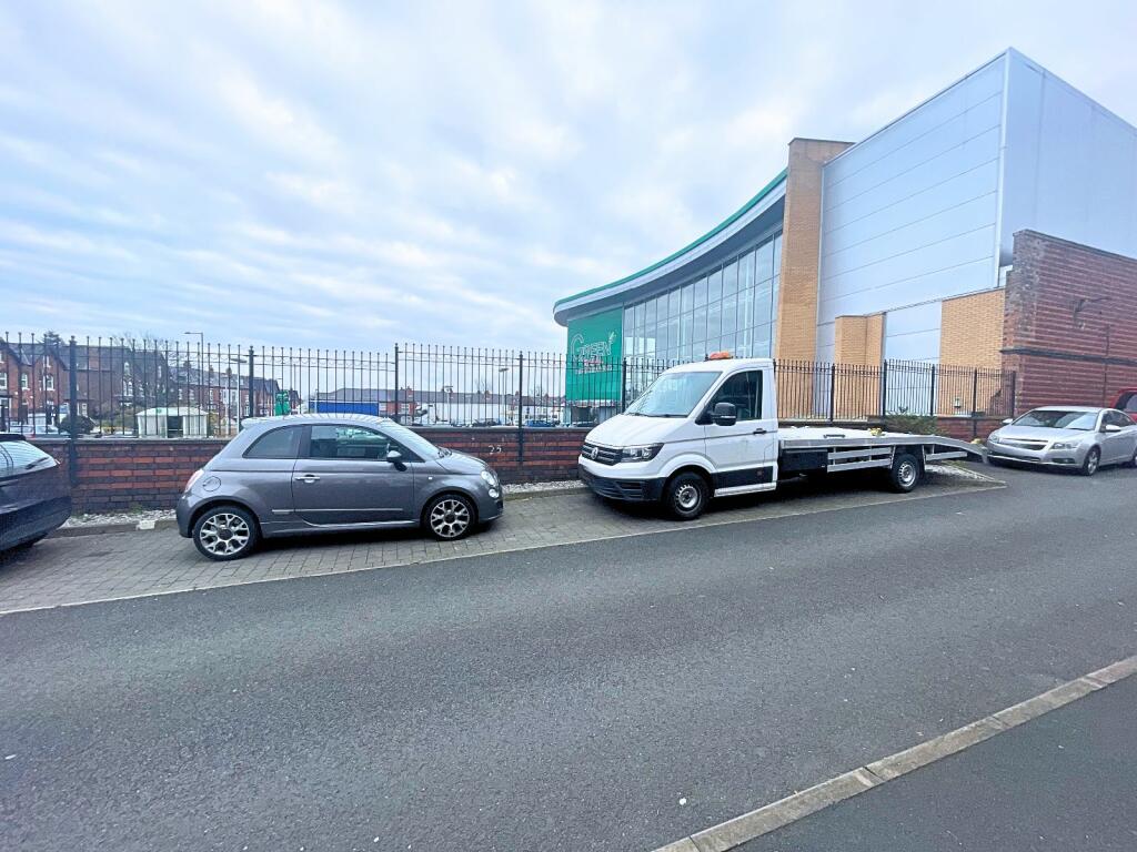 Allocated parking to side of property.