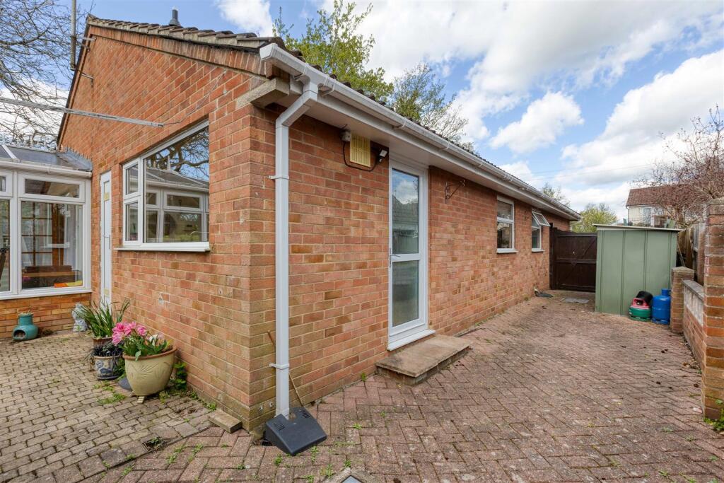 Block paved area to side