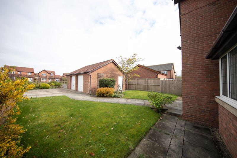 Front garden, garage and parking