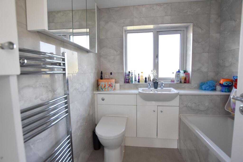 FAMILY BATHROOM WITH SHOWER OVER