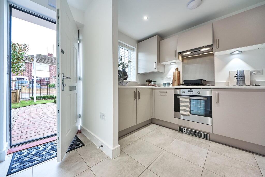 The kitchen sits at the front of the property
