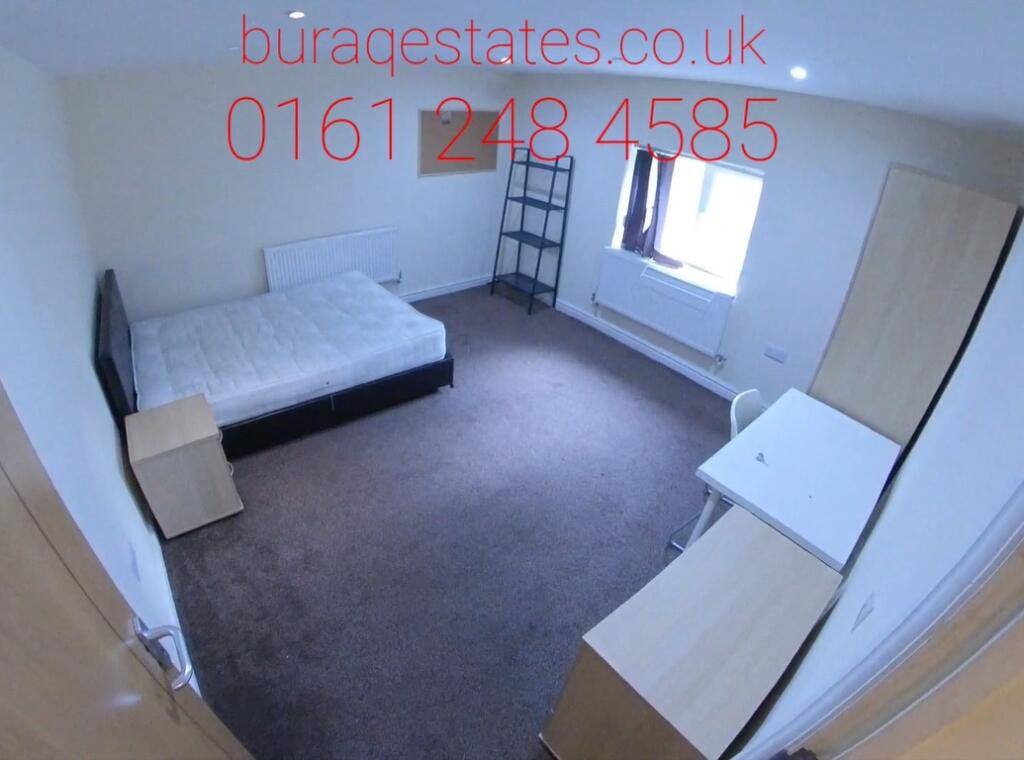 A neat single bedroom featuring a comfortable b...