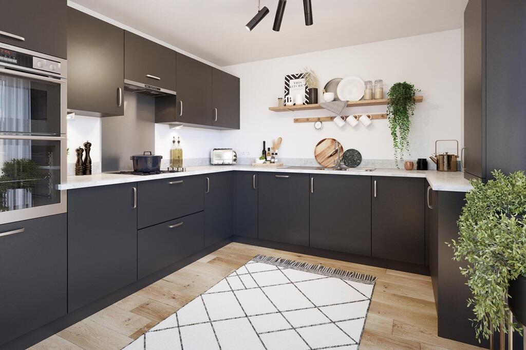 The kitchen benefits from ample storage