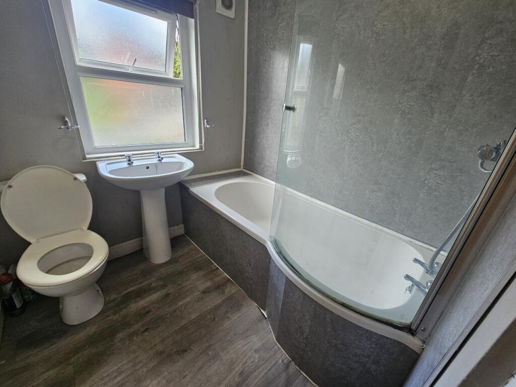 A clean, well-maintained bathroom featuring a b...