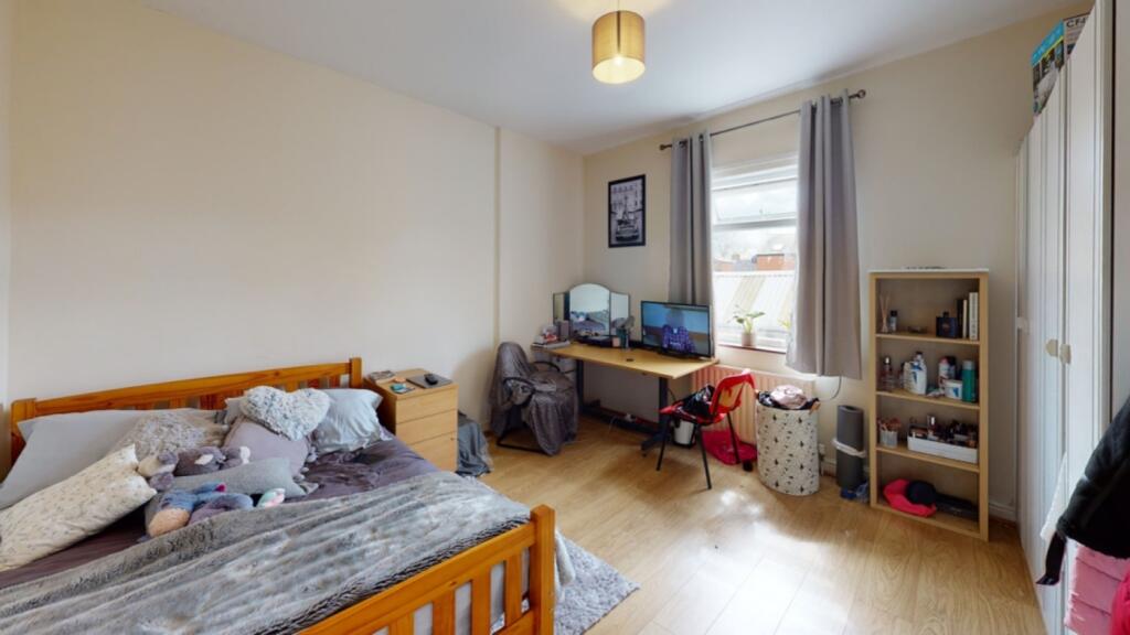 A bright and cozy double bedroom with ample nat...