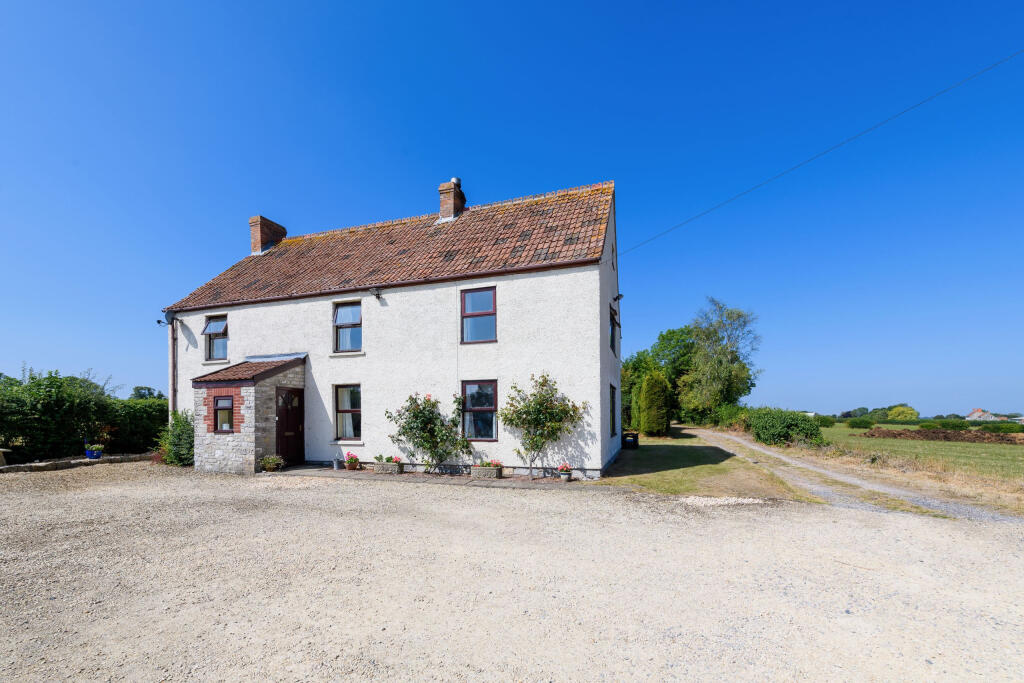 Front elevation, with extended driveway to the sid