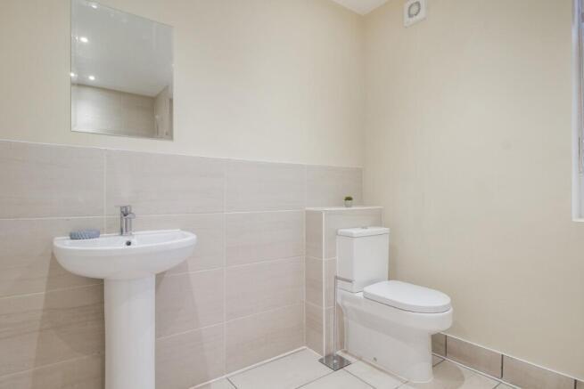 A clean and modern bathroom featuring a white b...