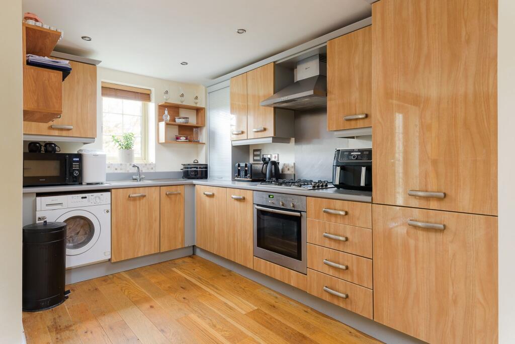 SITTING ROOM AND KITCHEN