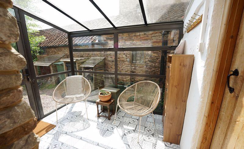 To the utility area and to the garden