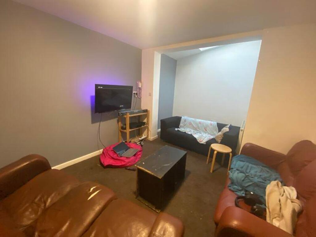 A cozy living room with comfortable seating, pe...