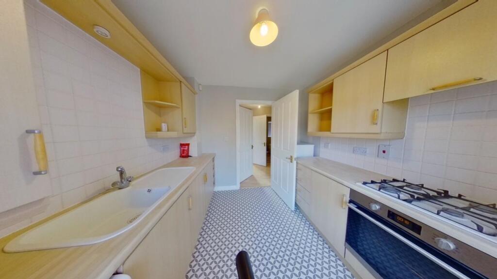 Bright and functional kitchen featuring a gas h...