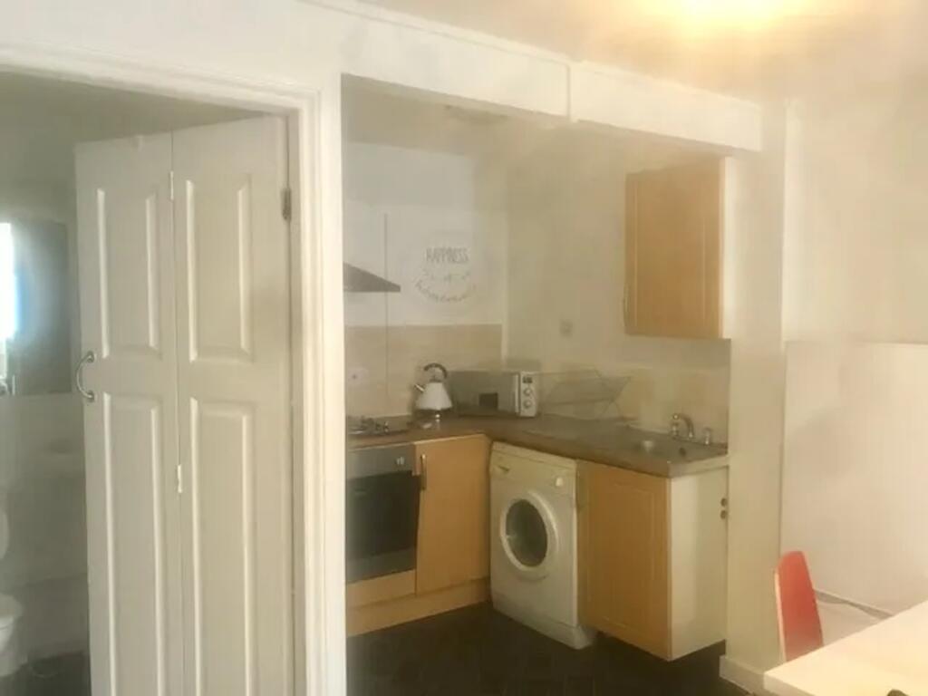 A functional kitchenette with modern appliances...