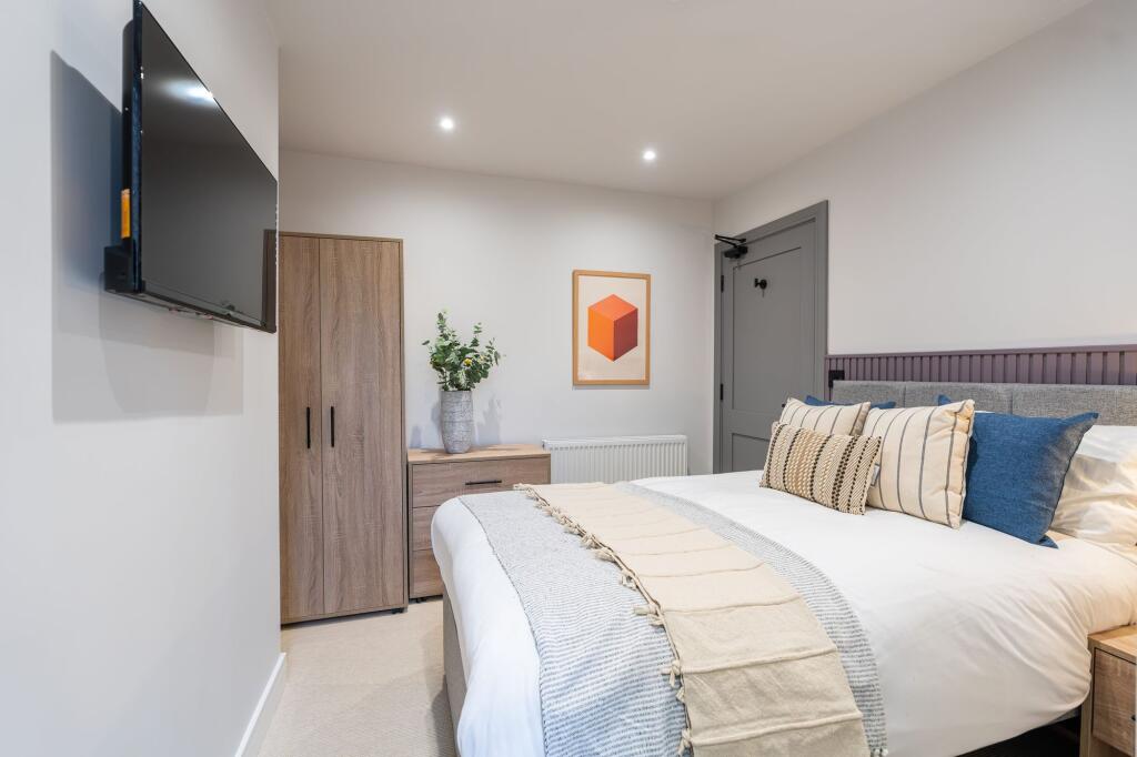 Bright and inviting master bedroom featuring a ...