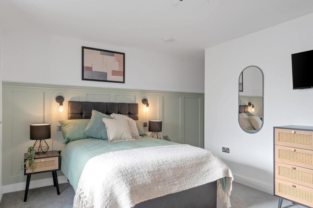 Bright and inviting master bedroom featuring a ...