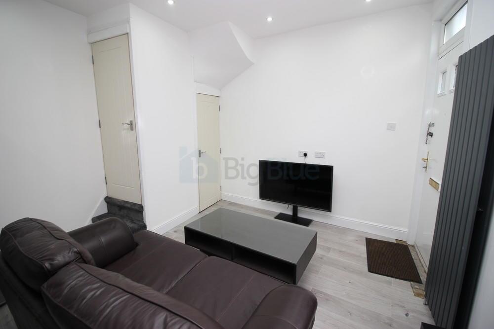 A modern living room featuring a comfortable br...