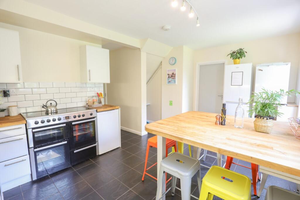 Bright and inviting kitchen with modern applian...
