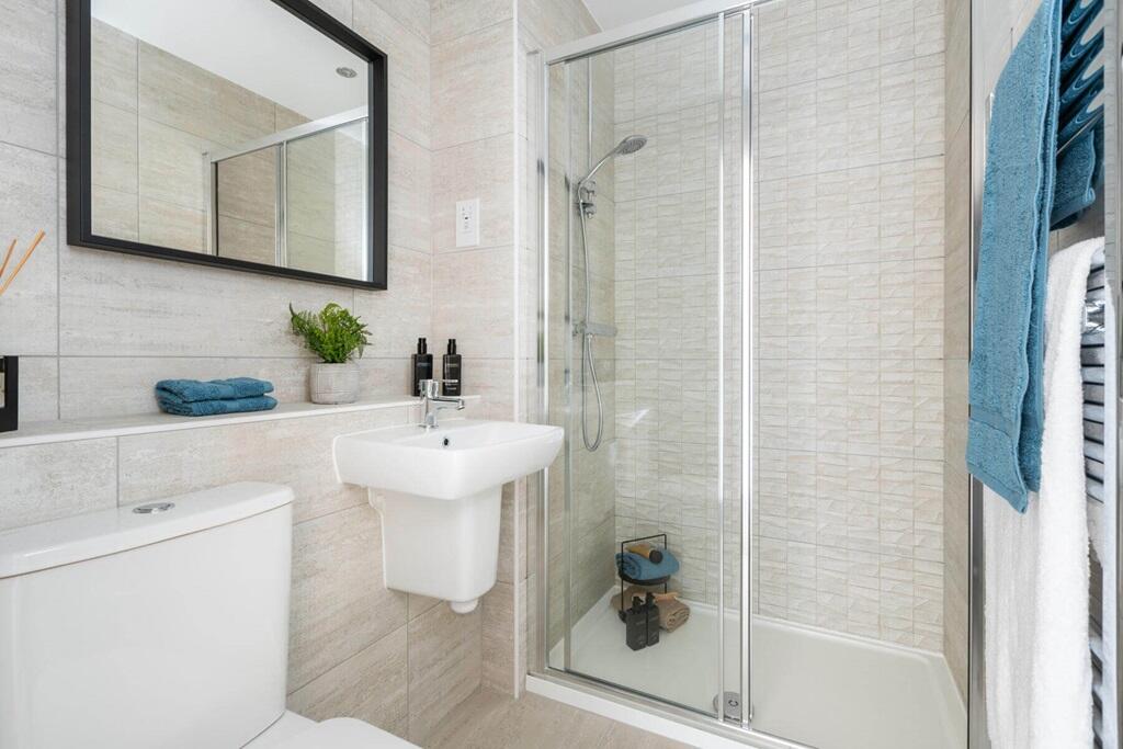 Bedroom 1 also features a private en suite shower room