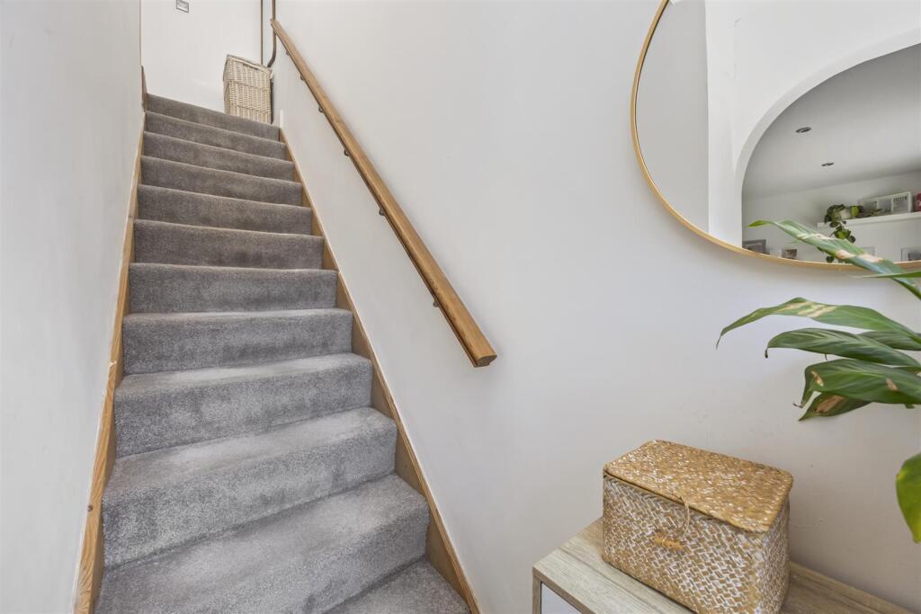 Stairs rising to First Floor