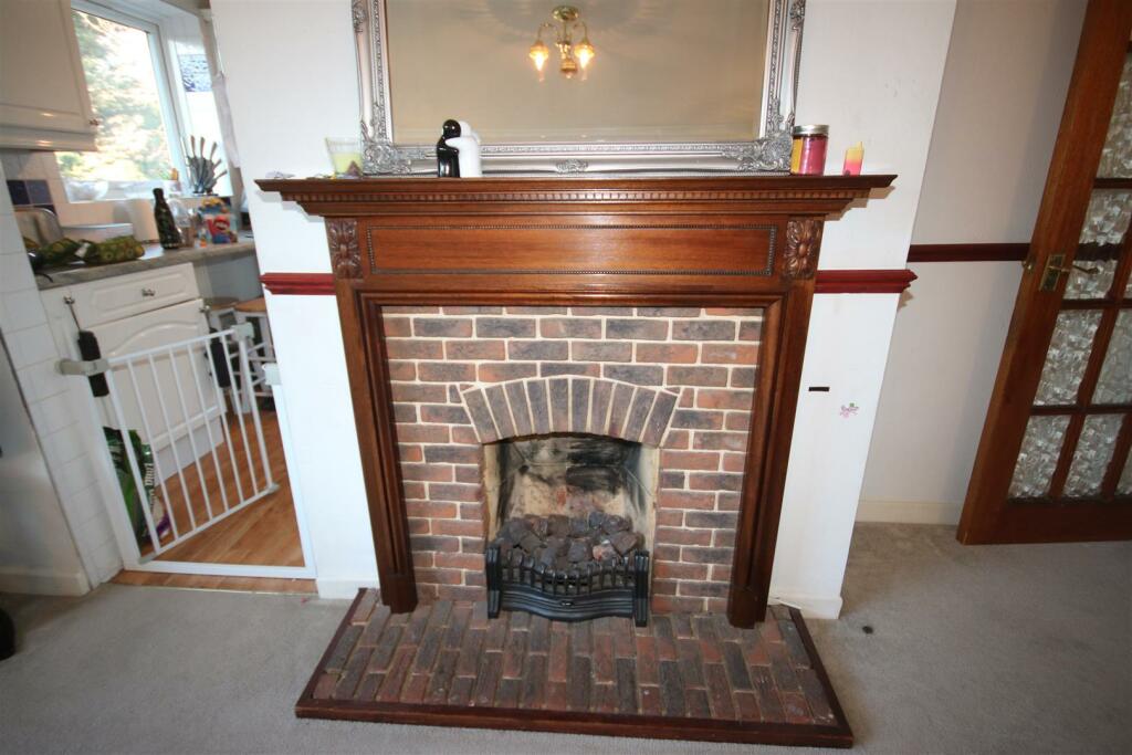 WOODEN  FEATURE FIREPLACE: