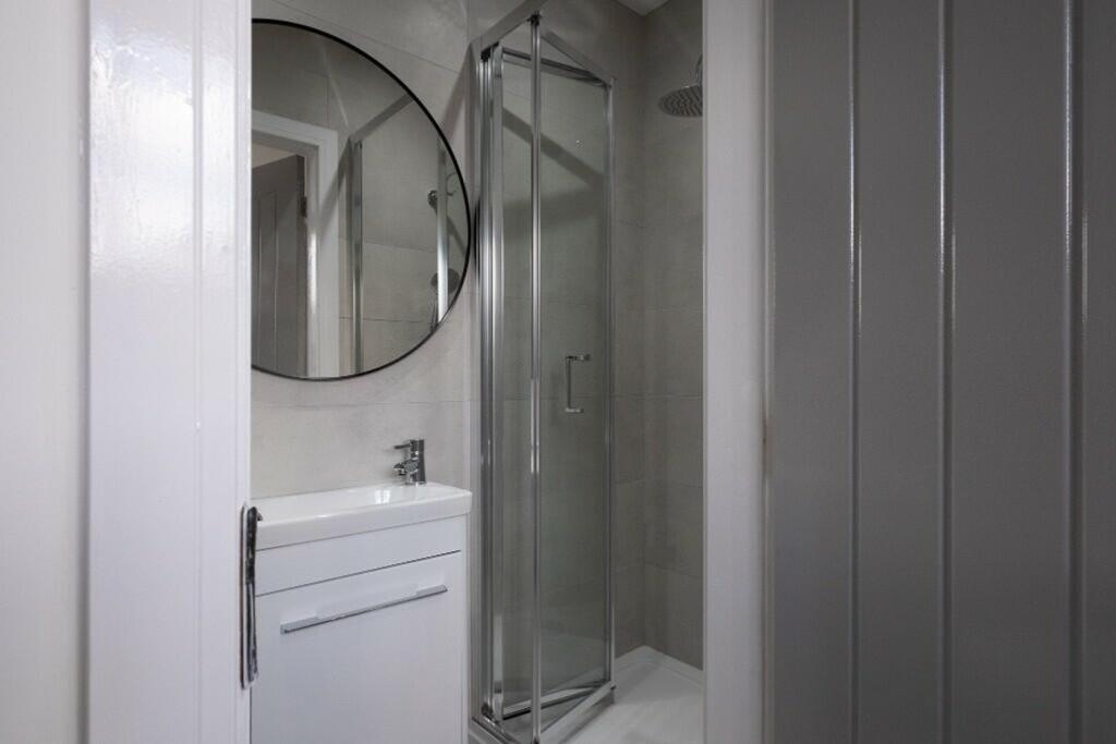 Modern bathroom featuring a sleek design with a...