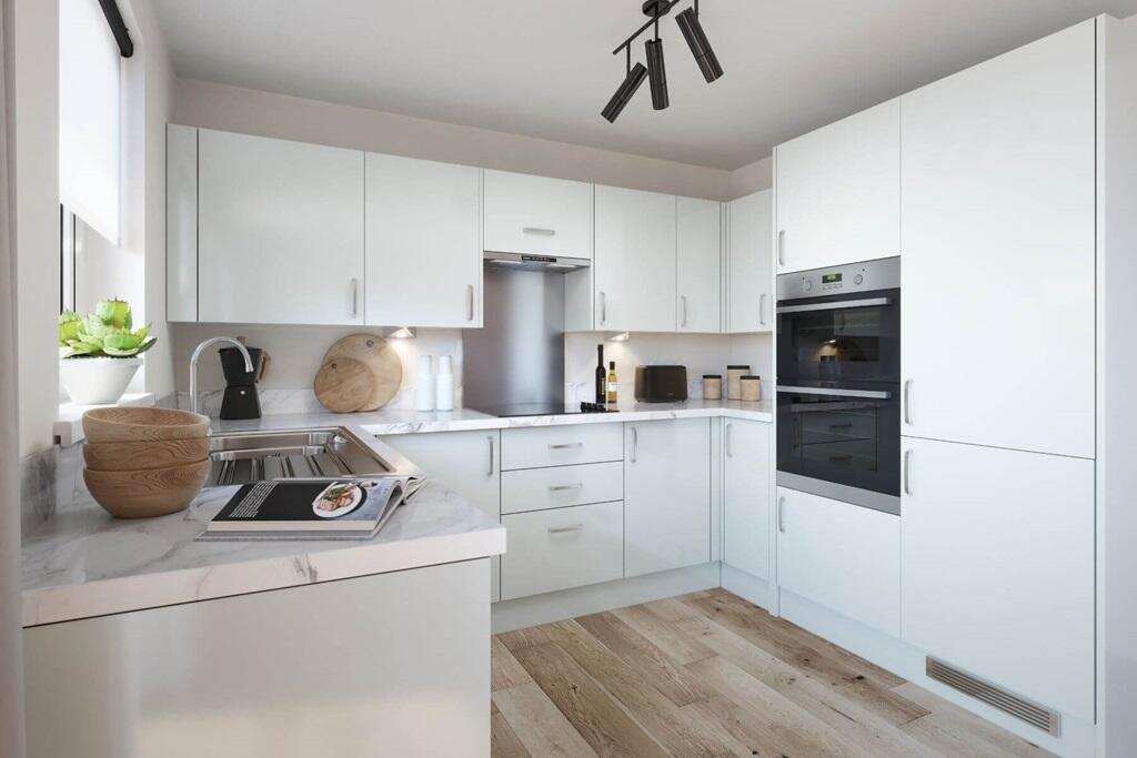 A modern kitchen with integrated appliances and clean, contemporary finishes for effortless everyda