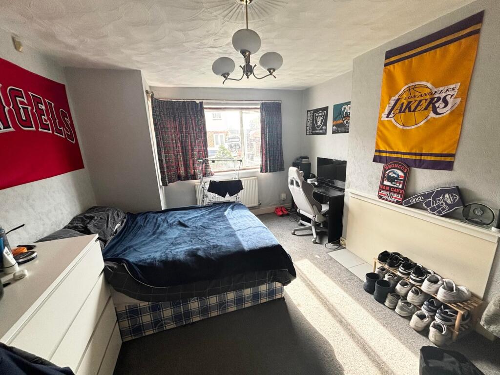 Spacious double bedroom featuring good natural ...