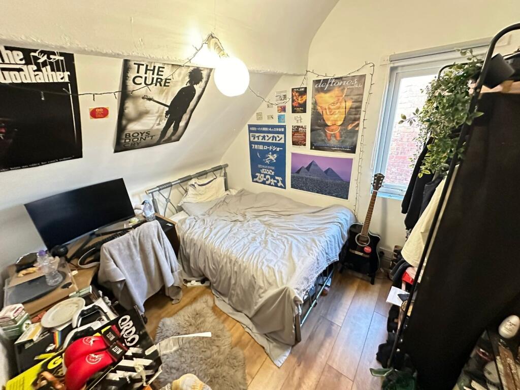 Cozy furnished bedroom with a double bed, study...