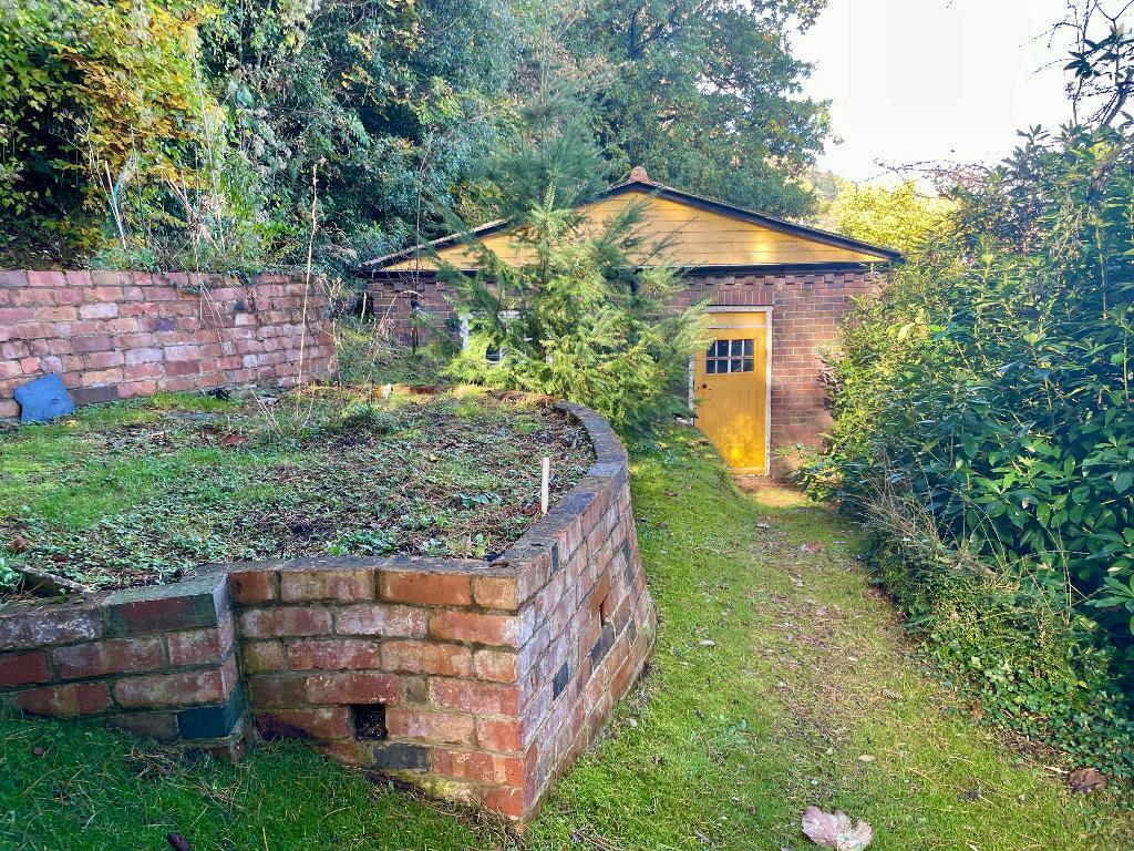 Excellent double garage at end of garden