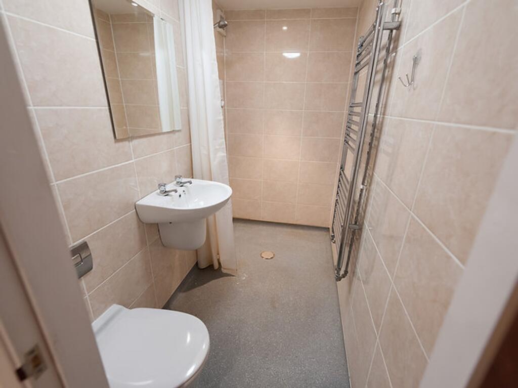 A well-maintained bathroom featuring modern fix...