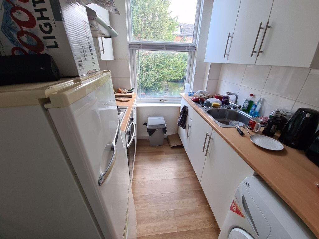 A bright and tidy kitchen with ample counter sp...