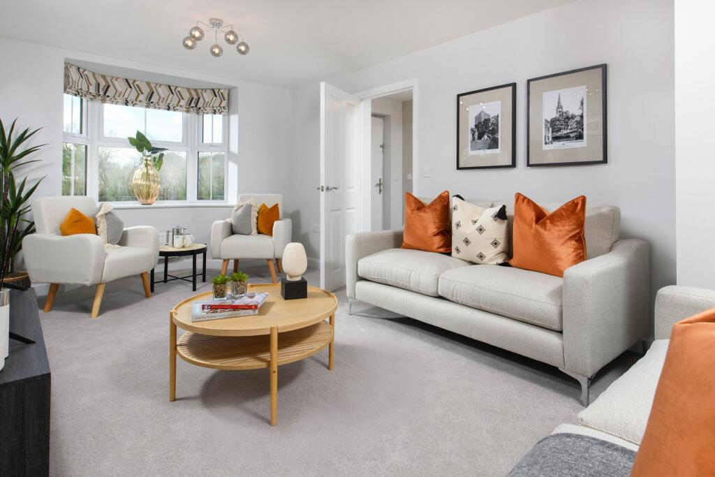 Bay-fronted lounge in Millford show home