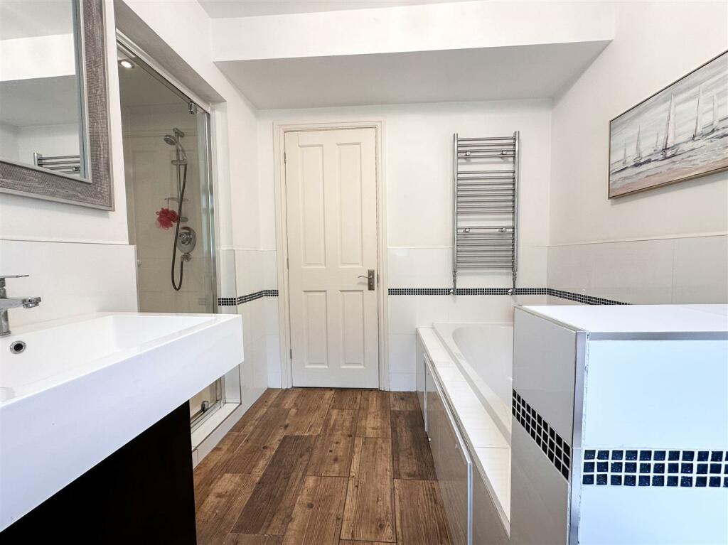 FAMILY BATH AND SHOWER ROOM