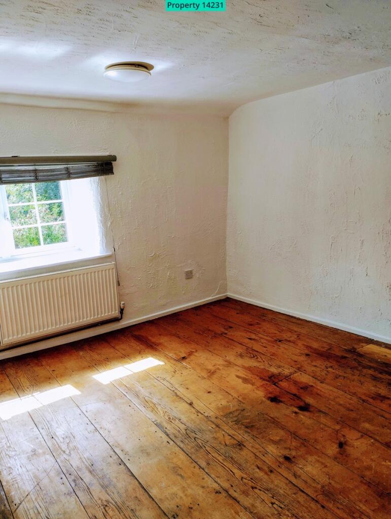 Bedroom with wooden floor