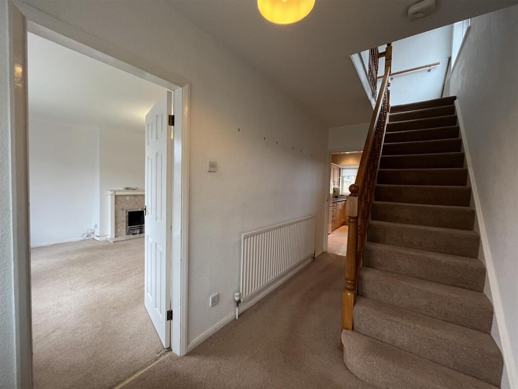 Stairs lead to first floor