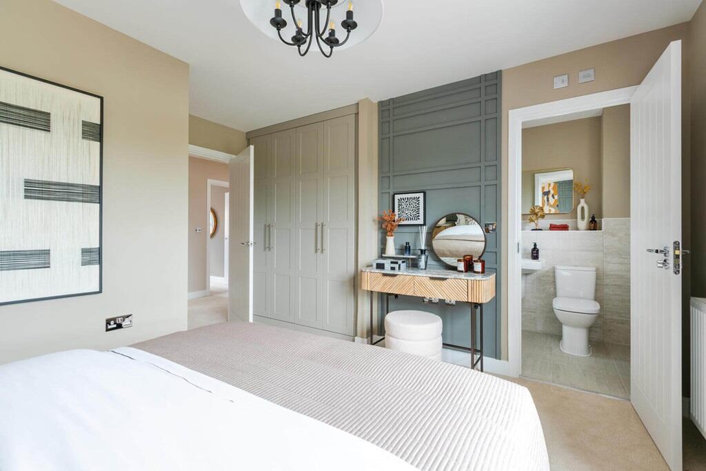 Bedroom 1 also hosts a private en suite shower room