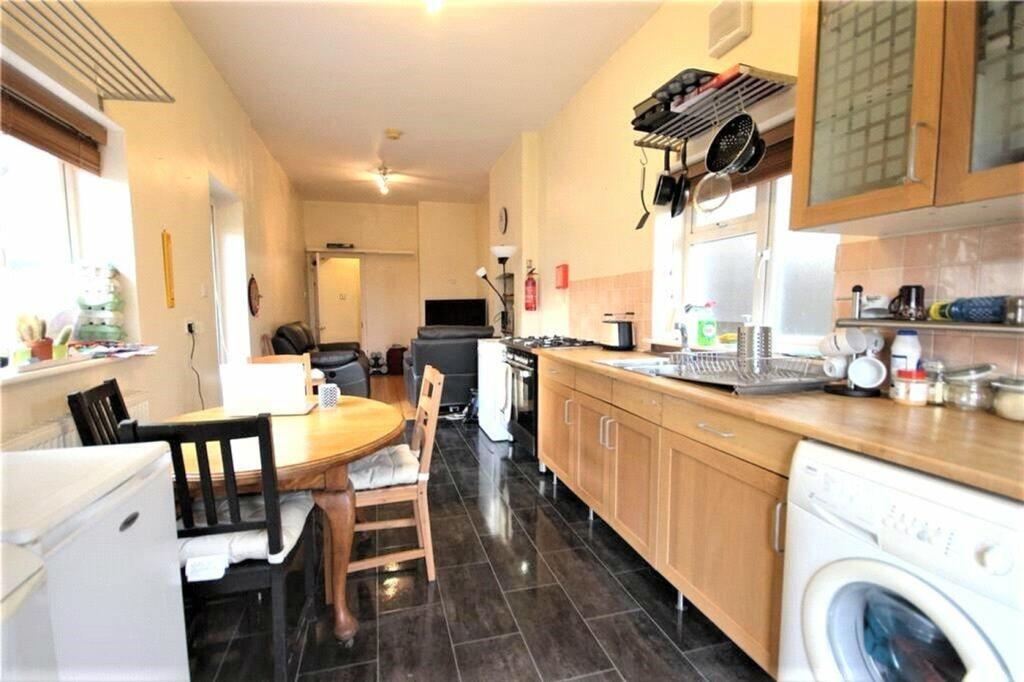 This spacious kitchen features ample cabinetry,...