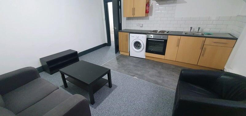 A modern kitchen area equipped with essential a...